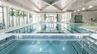An indoor pool with designated swimming lanes.