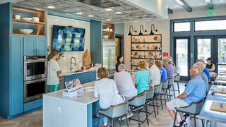 Amblebrook residents participating in a cooking demo class at the Nourish Kitchen.