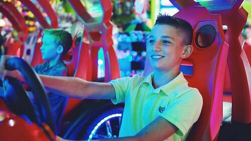 Young boys playing arcade games at Carlisle Sports Emporium in Gettysburg