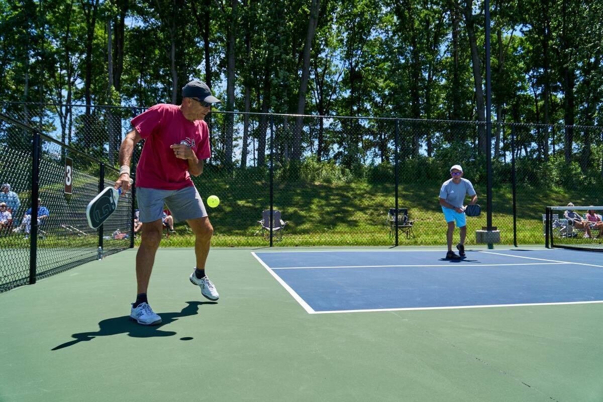 Amblebrook residents playing pickeball in the pickleball court.