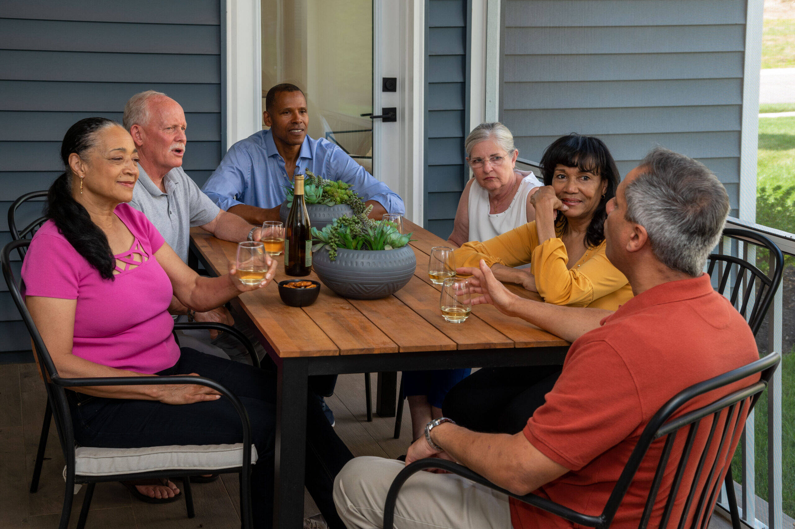 Active adult group of friends enjoying outdoor living space