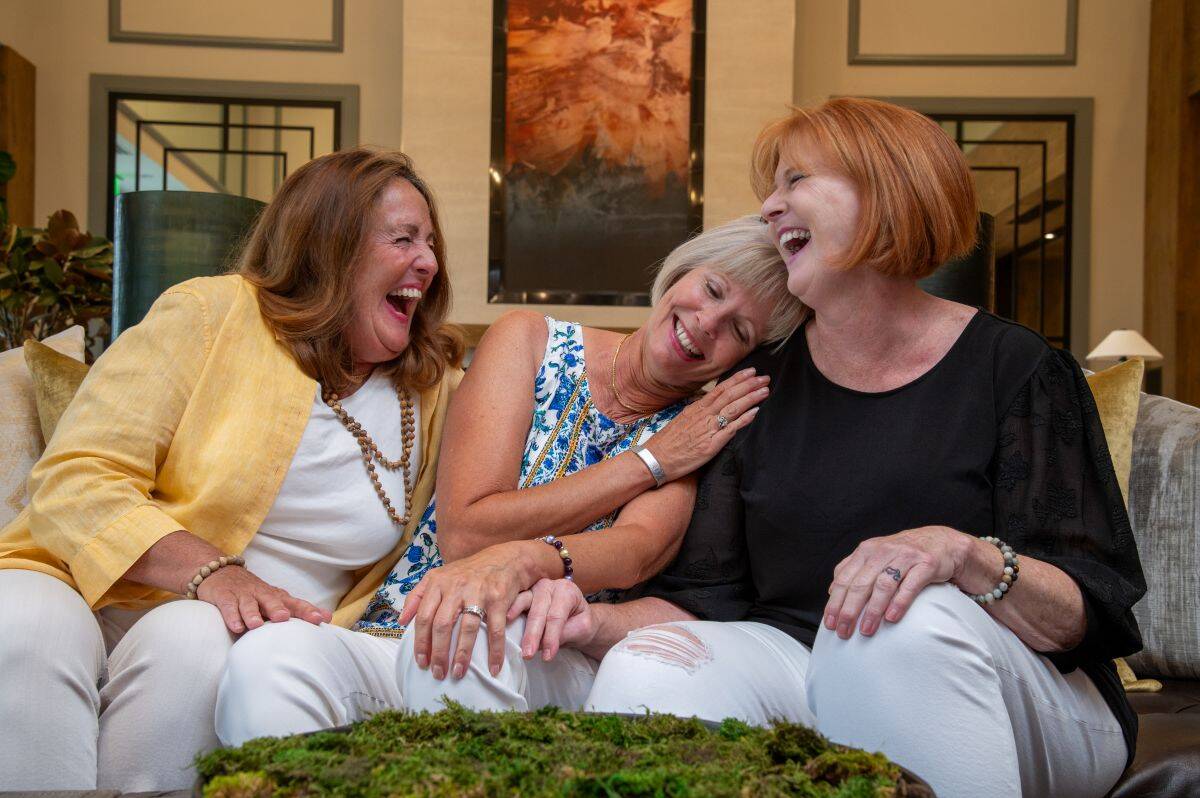 Amblebrook residents laughing and hugging. 