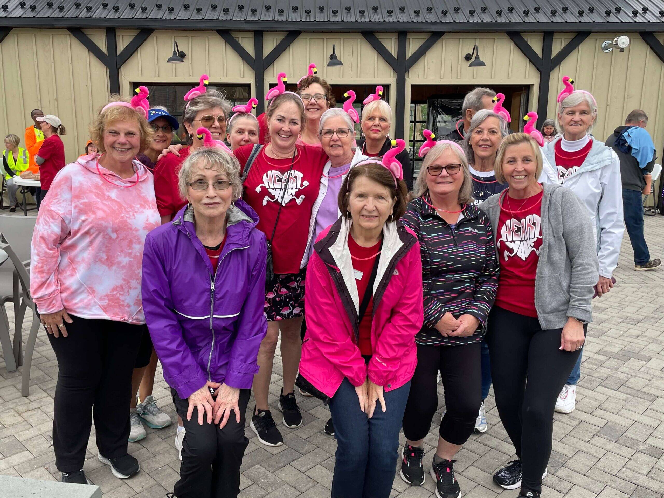 Amblebrook Heart Walk community team wearing pink and red jackets