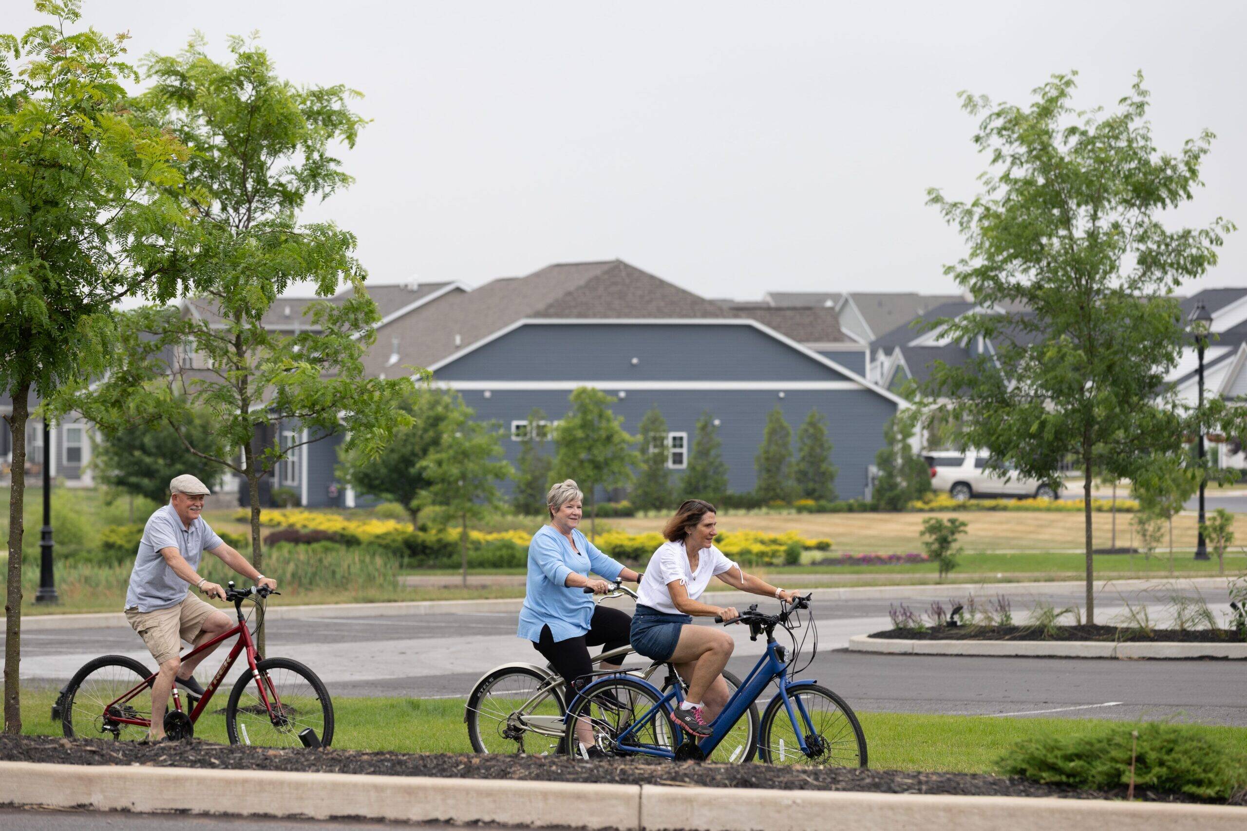 Three active adults cycling in Amblebrook at Gettysburg